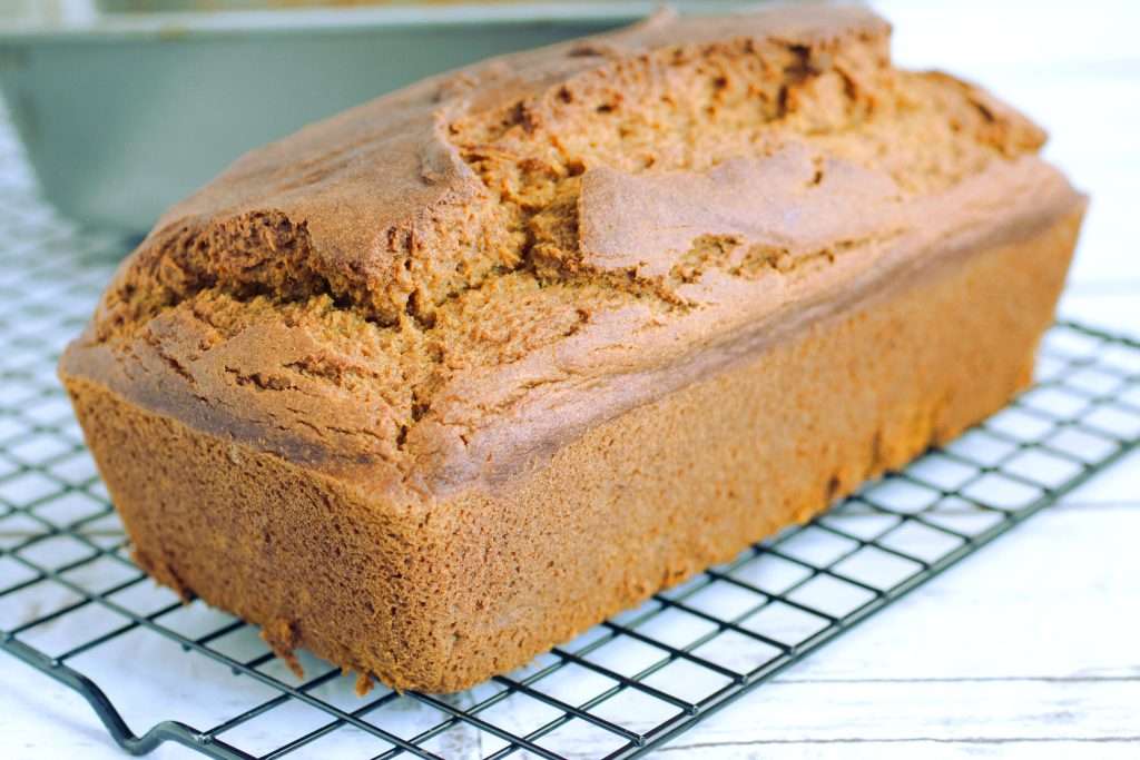 pumpkin bread loaf on a cooling rack